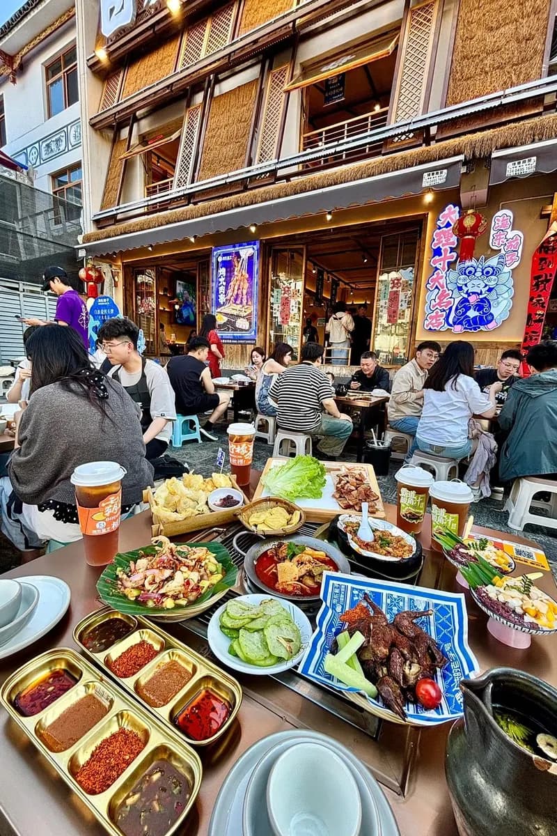 Shared grill table at a Dali night restaurant, with dipping spices and plates