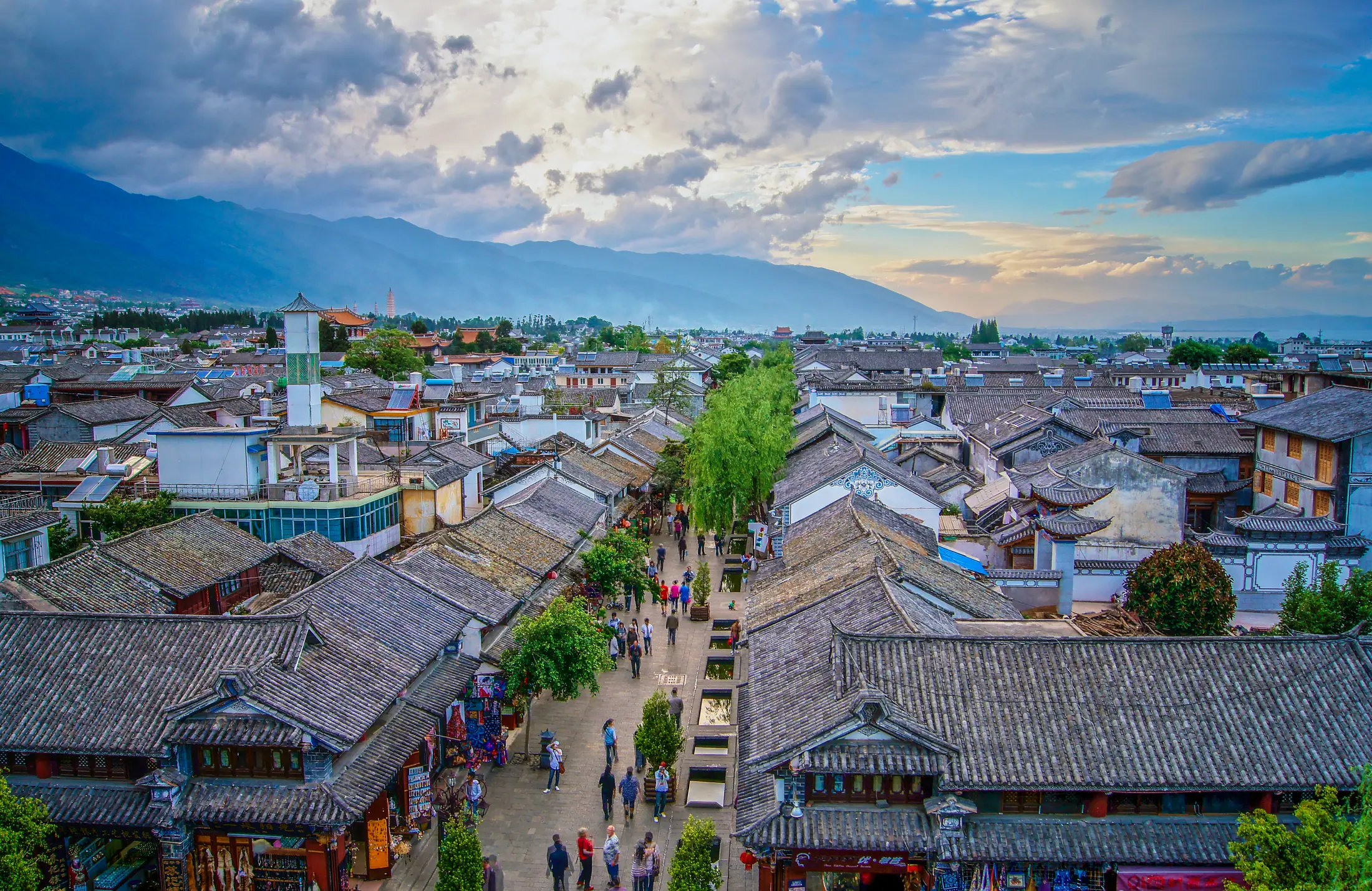 Looking down a pedestrian street in Dali Ancient Town toward Cangshan and Erhai