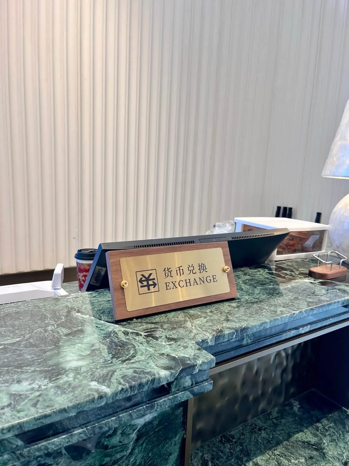 hotel front desk currency exchange service China RMB sign